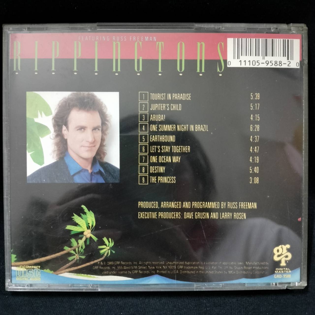 The Rippingtons Featuring Russ Freeman – Tourist In Paradise / USA / ปกมีจุดเหลือง / มีรอยบ้าง