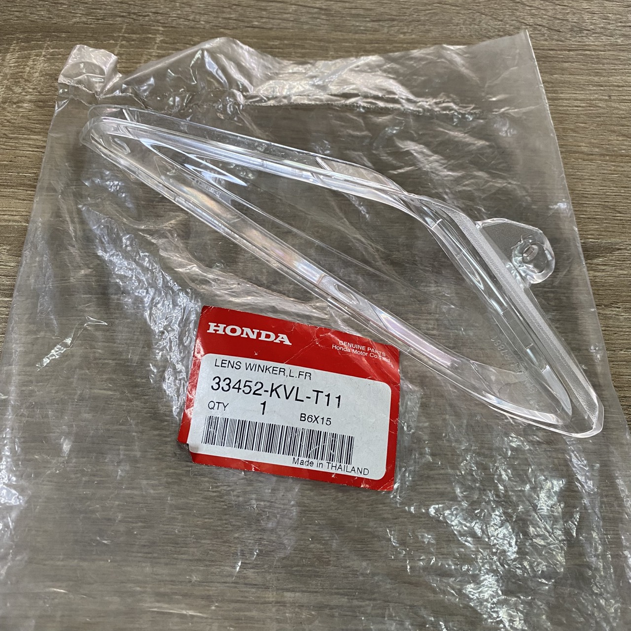 33452-KVL-T11 เลนส์ไฟเลี้ยวหน้าซ้าย WAVE100 ,WAVE125X (2007) อะไหล่แท้ HONDA