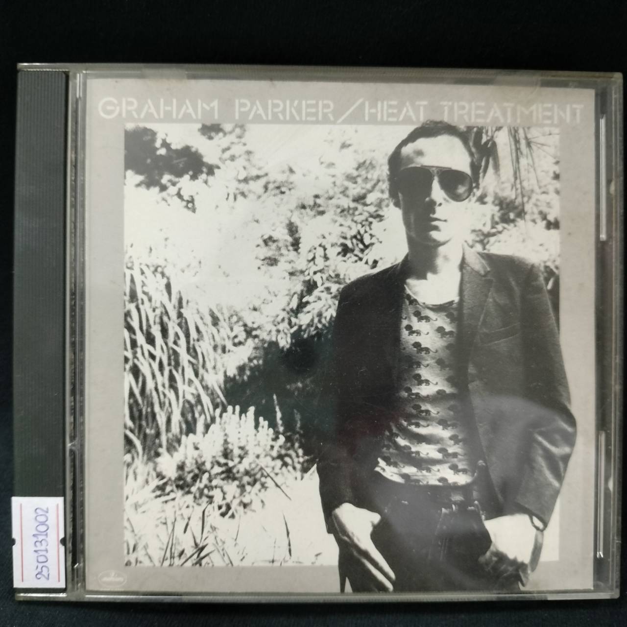 Graham Parker + The Rumour – Heat Treatment / USA / ปกในมีจุดเหลือง / มีรอยบ้าง