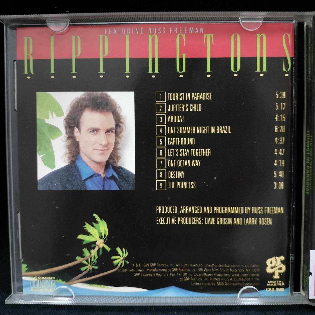 The Rippingtons Featuring Russ Freeman – Tourist In Paradise / USA / ปกมีจุดเหลือง / มีรอยบ้าง