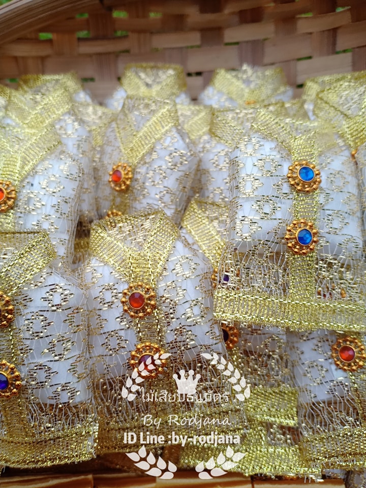 เหรียญโปรยทาน : เสื้อนาค