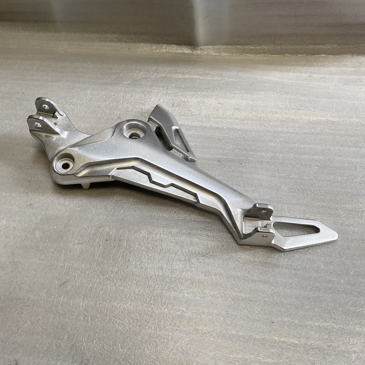 50700-K26-B00 ขายึดพักเท้าหน้าด้านซ้าย MSX125SF 2016-2020 อะไหล่แท้ HONDA