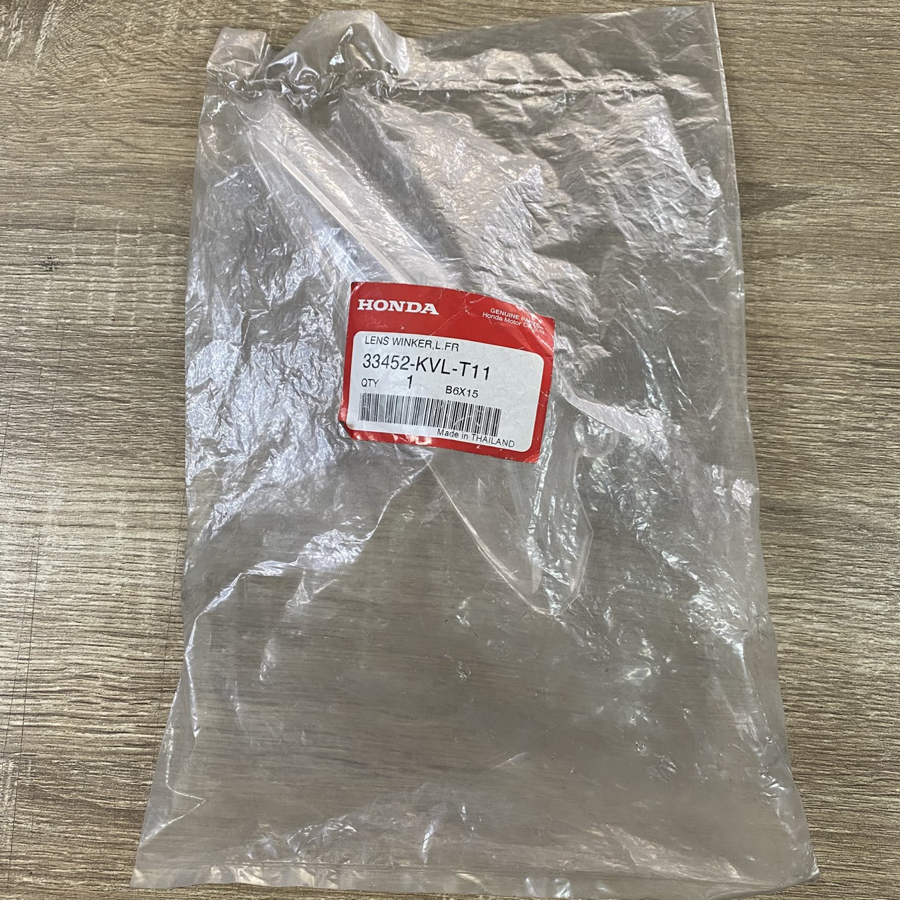 33452-KVL-T11 เลนส์ไฟเลี้ยวหน้าซ้าย WAVE100 ,WAVE125X (2007) อะไหล่แท้ HONDA