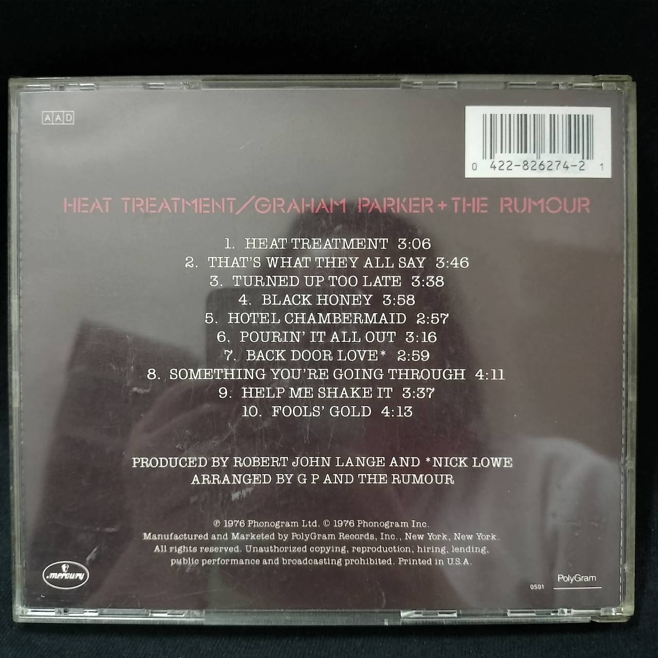 Graham Parker + The Rumour – Heat Treatment / USA / ปกในมีจุดเหลือง / มีรอยบ้าง