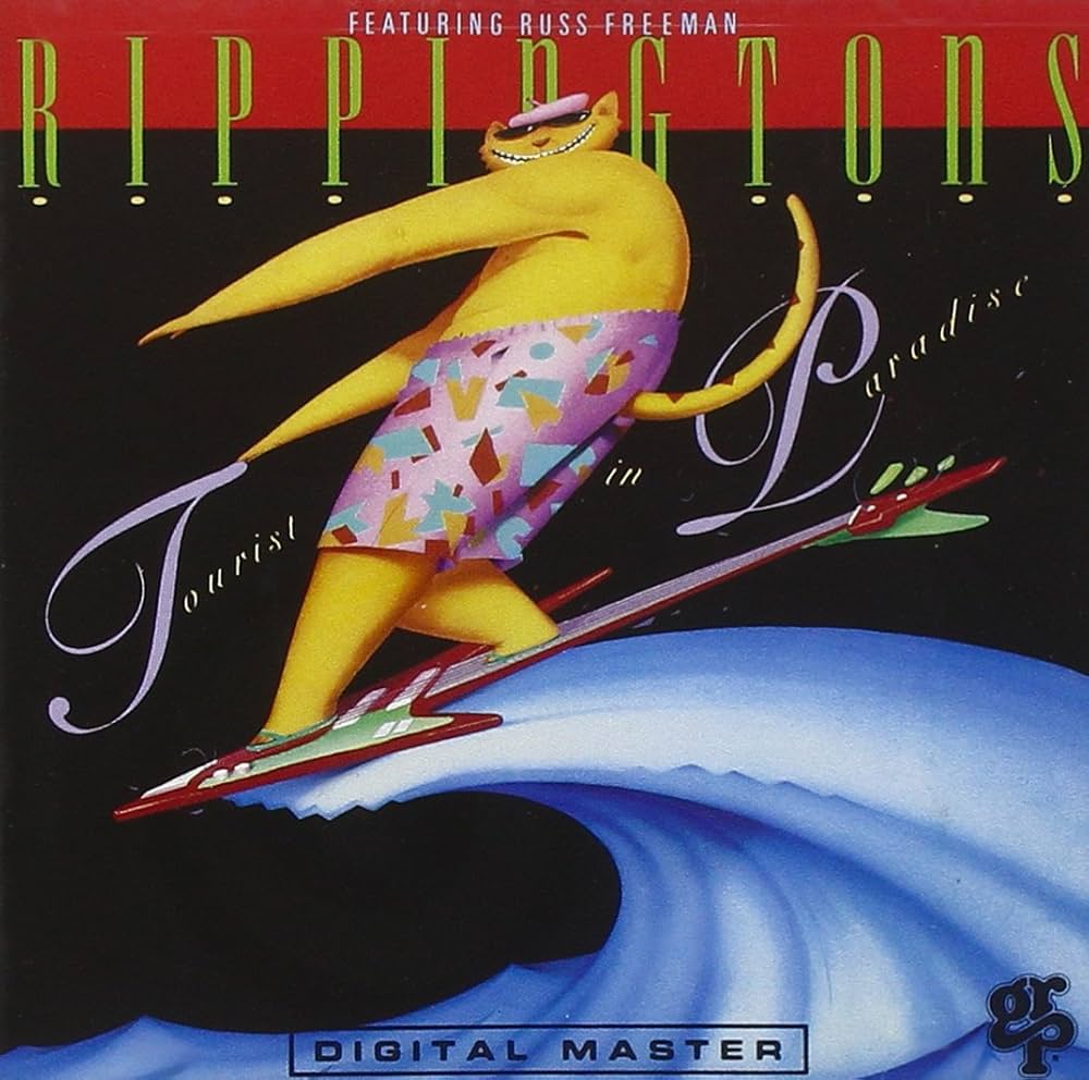 The Rippingtons Featuring Russ Freeman – Tourist In Paradise / USA / ปกมีจุดเหลือง / มีรอยบ้าง