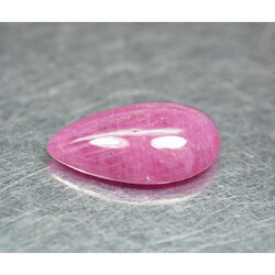 พลอยทับทิมหลังเบี้ย 6.95 กะรัตสีแดงชมพู